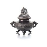 A CHINESE BRONZE TWO-HANDLED TRIPOD CENSER the squat globular body, with a band of alternating ‘