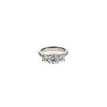 A DIAMOND RING claw-set to the centre with a round brilliant-cut diamond weighing 1.0cts, flanked on