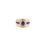 A SAPPHIRE AND DIAMOND RING the broad band centred with an oval mixed-cut sapphire weighing