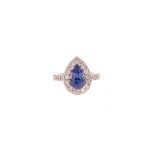 A TANZANITE AND DIAMOND RING centred with a pear-shaped mixed-cut tanzanite weighing 2.631cts, the