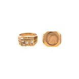 A COIN-MOUNTED RING centred with a 1/10 oz Kruger Rand, the tapered band with fluted design,