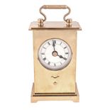 A BRASS TIMEPIECE IN THE DESIGN OF A CARRIAGE CLOCK, MODERN the 6cm white dial with Roman hour