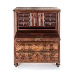 A MAHOGANY AND ROSEWOOD BIEDERMEIER SECRETAIRE, FIRST HALF 19TH CENTURY the shaped top above a