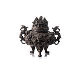 A CHINESE BRONZE TWO-HANDLED TRIPOD CENSER, MING, 1368-1644 the reticulated globular body with two