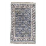 A CHINESE NEPALESE SILK CARPET, MODERN the ivory field with an overall design of bold floral