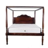 AN ENGLISH MAHOGANY FOUR-POSTER BED, 20TH CENTURY the carved and shaped head-board between square-