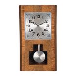 AN AMERICAN MAHOGANY WALL CLOCK, EARLY 20TH CENTURY the 18cm by 18,5cm rectangular aluminium dial