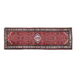 A MELAYER RUNNER, WEST PERSIA, MODERN the red field with a small ivory medallion and red