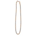 AN 18CT GOLD NECKLACE composed of curb link chain, alternating white and yellow gold, impressed