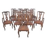 A SET OF TWELVE MAHOGANY CHIPPENDALE STYLE DINING CHAIRS comprising ten side chairs and two carvers,