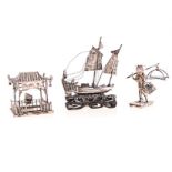 A CHINESE SILVER MINIATURE JUNK SHIP, HALLMARKED ON SAIL, EARLY 20TH CENTURY on a detachable foliate