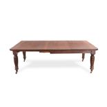 A MAHOGANY EXTENDING DINING TABLE, LATE 19TH/EARLY 20TH CENTURY the moulded, rounded rectangular top