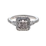 A DIAMOND RING claw-set to the centre with a radiant-cut diamond weighing 1.05cts, flanked on wither