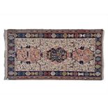 A NORTH WEST PERSIAN FLATWEAVE RUG, MODERN the ivory field with three medallions, all with multi-