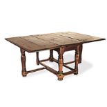 A CAPE TEAK AND STINKWOOD GATE-LEG TABLE, LATE 18TH/EARLY 19TH CENTURY the hinged rectangular top