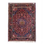 A KURDI RUG, WEST PERSIA, MODERN the red field with a blue and rose floral medallion and similar