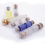 A GROUP OF 19TH CENTURY METAL-MOUNTED GLASS SCENT BOTTLES of various shapes and sizes, small dents