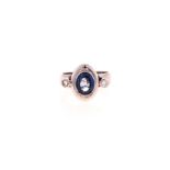 A SAPPHIRE AND DIAMOND RING centred with an oval mixed-cut sapphire weighing approximately 2.