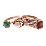 A MISCELLANEOUS GROUP OF FOUR GEM-SET RINGS of various designs and sizes (4)