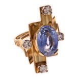A SAPPHIRE AND DIAMOND DRESS RING composed of three curved stylised rectangular-shapes centred