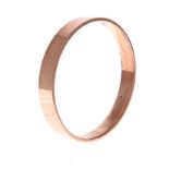 A 9CT ROSE GOLD BANGLE of plain form, impressed 9ct, inner diameter approximately 79mm