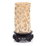 A CHINESE CARVED IVORY TUSK VASE, LATE 19TH CENTURY NOT SUITABLE FOR EXPORT carved in high relief