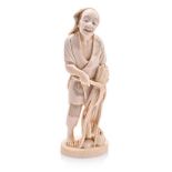 A JAPANESE CARVED IVORY OKIMONO OF A WHEAT FARMER, MEIJI, 1868-1912 NOT SUITABLE FOR EXPORT