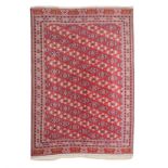 A YAMUT TURKOMAN CARPET, PERSIA, MODERN the red field with diagonally arranged kepse gul depicted in