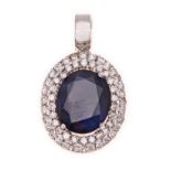 A SAPPHIRE AND DIAMOND PENDANT centred with an oval mixed-cut sapphire weighing approximately 5.