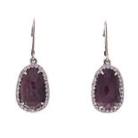 A PAIR OF RUBY AND DIAMOND PENDANT EARRINGS each claw-set with a faceted stylised oval cabochon ruby