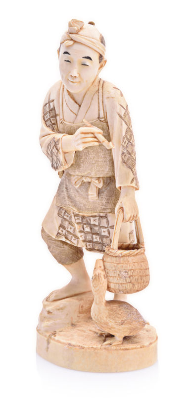 A JAPANESE CARVED IVORY FIGURE OF A FARMER FEEDING A GOOSE, MEIJI, 1868-1912 NOT SUITABLE FOR EXPORT