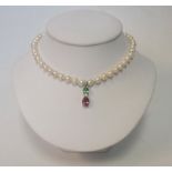 A SINGLE-STRAND PEARL NECKALCE comprised of pinkish cream Japanese Marine pearls measuring