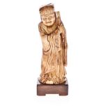 A CHINESE CARVED IVORY FIGURE OF LUXING, MING, 1368-1644 NOT SUITABLE FOR EXPORT standing, the