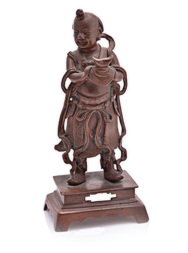 A CHINESE PATINATED BRONZE FIGURE OF A BOY IMMORTAL the standing figure wearing a flowing dhoti