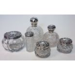 AN ASSEMBLED SET OF SIX SILVER-MOUNTED CUT-GLASS SCENT BOTTLES, VARIOUS MAKERS AND DATES,