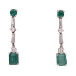 A PAIR OF DIAMOND AND EMERALD EARRINGS each surmount claw-set with a round-cut emerald weighing