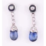 A PAIR OF SAPPHIRE AND DIAMOND PENDANT EARRINGS each surmount centred with a circular cabochon