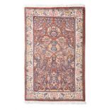 A QUM CARPET, PERSIA, MODERN the brown field with an ascending design of multicoloured flowering
