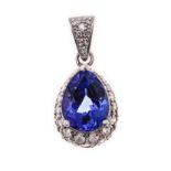 A TANZANITE AND DIAMOND PENDANT centred with a mixed-cut pear-shaped tanzanite weighing 4.67cts, the
