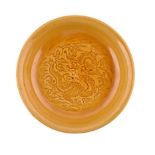 A CHINESE IMPERIAL YELLOW-GLAZED 'DRAGON' SAUCER DISH, 19TH CENTURY the interior incised with a