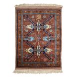 A CAUCASIAN RUG, CIRCA 1950 the brown field with two seichour medallions depicted in ivory, sky-