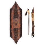 AN IBAN SHIELD, SWORD AND SCABBARD, BORNEO the bone handle stuffed with trophy hair, the scabbard
