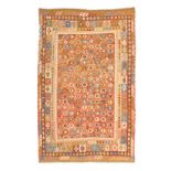 A SHIRAZ KELIM CARPET, MODERN the red field with overall multicoloured guls within a similar border,