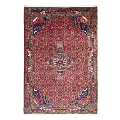 A KURDI CARPET, WEST PERSIA, MODERN the red field with a walnut star medallion, dark-blue