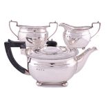 A GEORGE VI SILVER THREE-PIECE TEA SET, ELKINGTON & CO LTD, BIRMINGHAM, 1938 comprising: a teapot, a