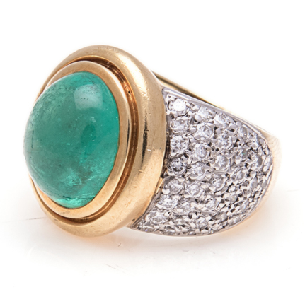 AN EMERALD AND DIAMOND DRESS RING, JENNA CLIFFORD centred with a bezel-set cabochon-cut emerald