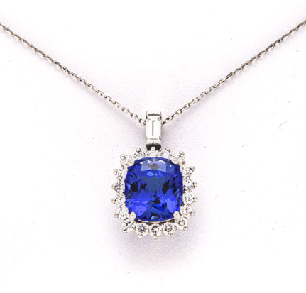 A TANZANITE AND DIAMOND PENDANT centred with a claw-set cushion-cut tanzanite weighing 8.62cts,
