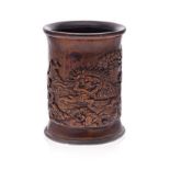 A CHINESE CARVED BAMBOO BRUSH POT, 19TH CENTURY carved with a continuous festive scene depicting