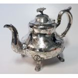 A CONTINENTAL SILVER TEAPOT the baluster body chased with scrolling foliage, flowerheads and two