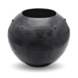A POT BY ISABEL SBIYA the ovoid body with impressed geometric decoration, the base inscribed 'Isabel